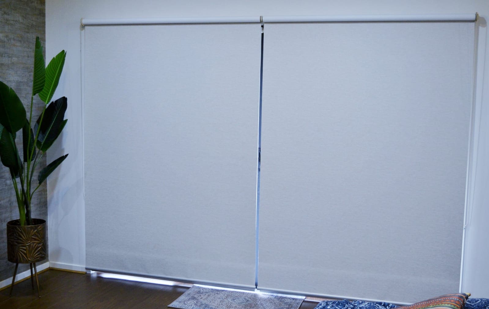 Sunscreen roller blinds on a sliding door